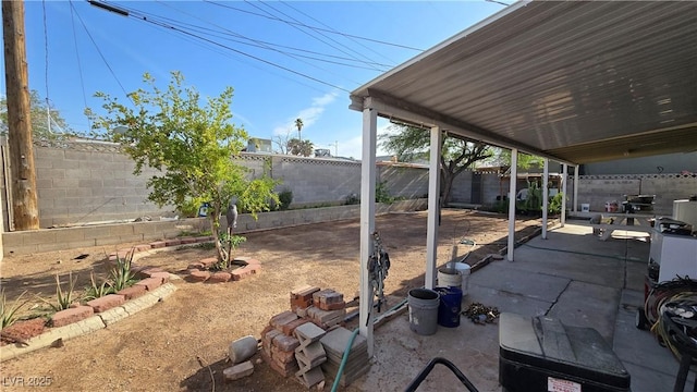 5209 Del Monte Ave, Las Vegas, NV 89146 - fenced backyard with a patio