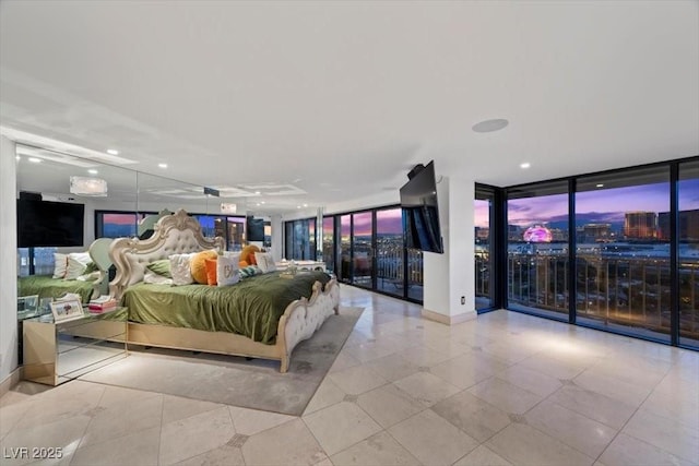 3111 Bel Air Dr Unit 21A & 21C, Las Vegas, NV 89109 - bedroom with access to outside, a wall of windows, and recessed lighting