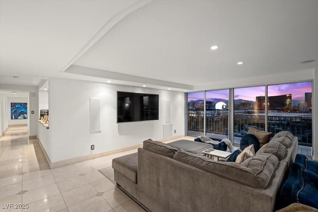 3111 Bel Air Dr Unit 21A & 21C, Las Vegas, NV 89109 - living room with a wall of windows, light tile patterned floors, and recessed lighting