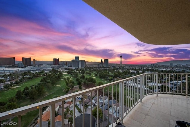 3111 Bel Air Dr Unit 21A & 21C, Las Vegas, NV 89109 - balcony at dusk featuring a city view