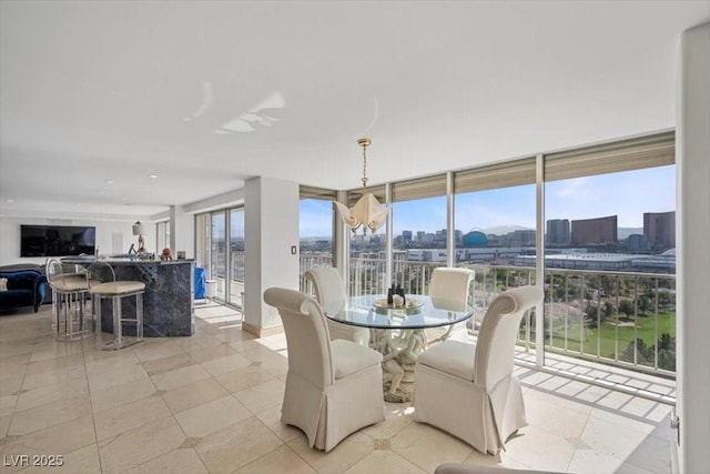 3111 Bel Air Dr Unit 21A & 21C, Las Vegas, NV 89109 - dining area with plenty of natural light and a view of city