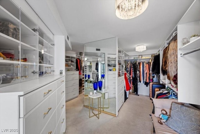 3111 Bel Air Dr Unit 21A & 21C, Las Vegas, NV 89109 - walk in closet with a chandelier