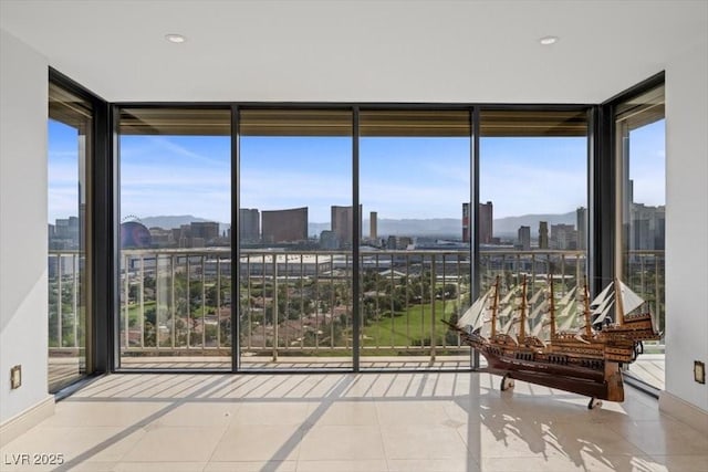3111 Bel Air Dr Unit 21A & 21C, Las Vegas, NV 89109 - sunroom featuring a view of skyline and healthy amount of natural light