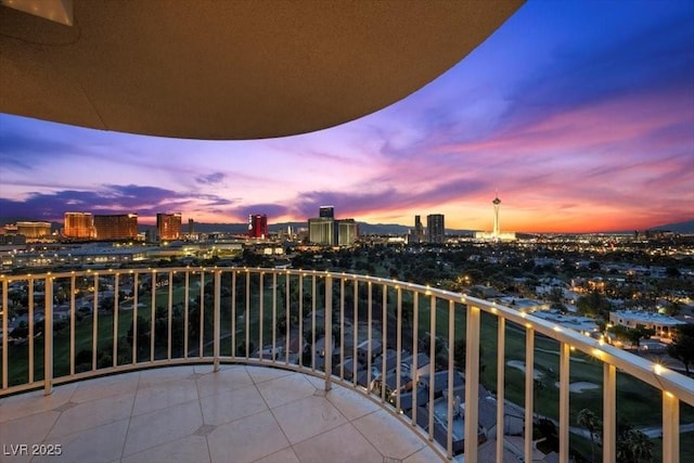 3111 Bel Air Dr Unit 21A & 21C, Las Vegas, NV 89109 - balcony at dusk featuring a view of city