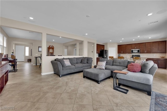 2714 Frabiele St, Henderson, NV 89044 - living room featuring light tile patterned floors and recessed lighting