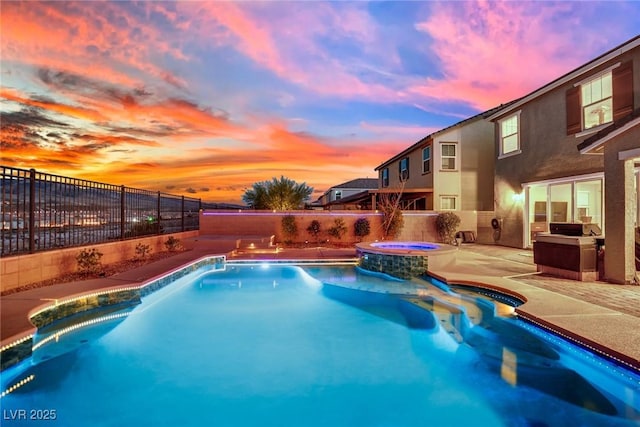 2714 Frabiele St, Henderson, NV 89044 - pool at dusk with a fenced backyard, a patio area, and a pool with connected hot tub