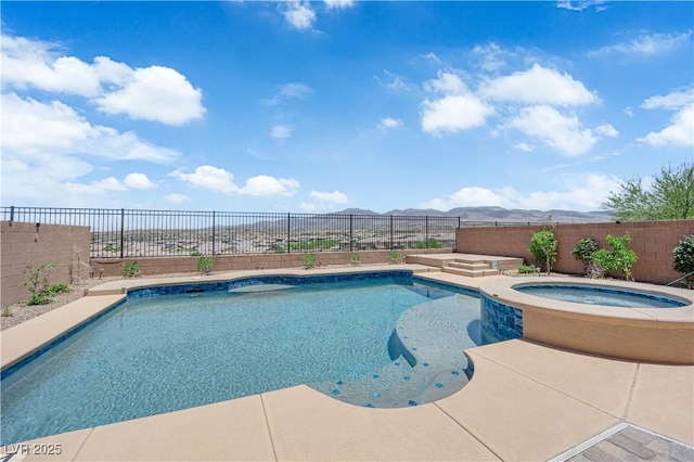 2714 Frabiele St, Henderson, NV 89044 - view of swimming pool with a mountain view, a fenced backyard, and a pool with connected hot tub