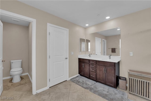 2714 Frabiele St, Henderson, NV 89044 - bathroom featuring double vanity, tile patterned flooring, and recessed lighting