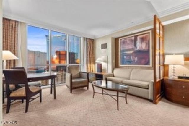 135 E Harmon Ave Unit 407, Las Vegas, NV 89109 - living room with light colored carpet and crown molding