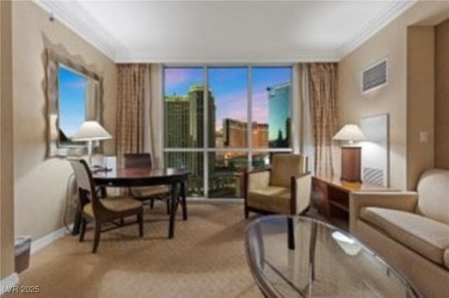 135 E Harmon Ave Unit 407, Las Vegas, NV 89109 - carpeted living room with expansive windows and ornamental molding
