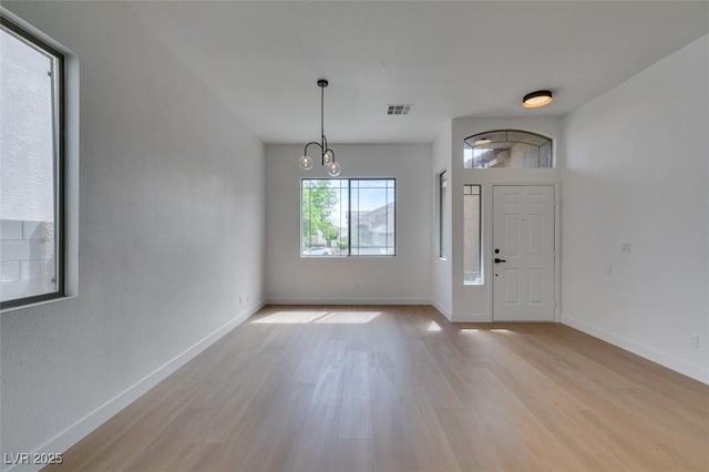 10452 Niagara Falls Ln, Las Vegas, NV 89144 - entryway featuring light wood finished floors and a chandelier