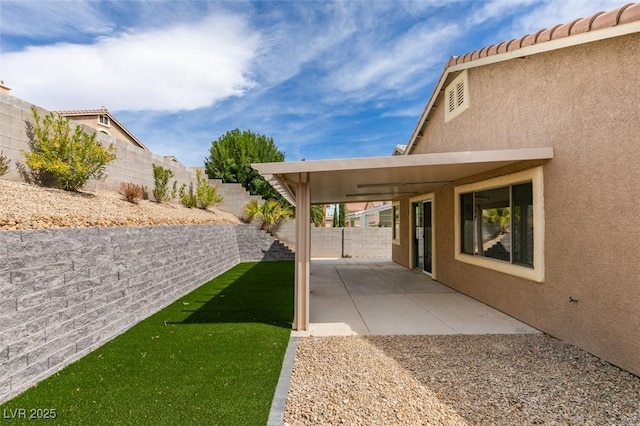 10452 Niagara Falls Ln, Las Vegas, NV 89144 - fenced backyard with a patio area