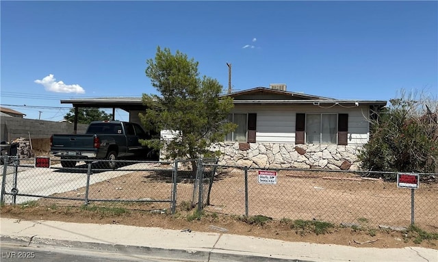 2244 Pariva St, Las Vegas, NV 89115 - view of front of property with a fenced front yard and a carport