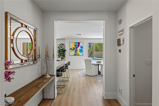 712 Proud Eagle Ln, Las Vegas, NV 89144 - hallway featuring light wood-style flooring and baseboards