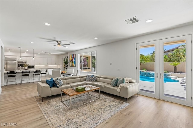 712 Proud Eagle Ln, Las Vegas, NV 89144 - living area with recessed lighting, light wood-type flooring, french doors, and a ceiling fan