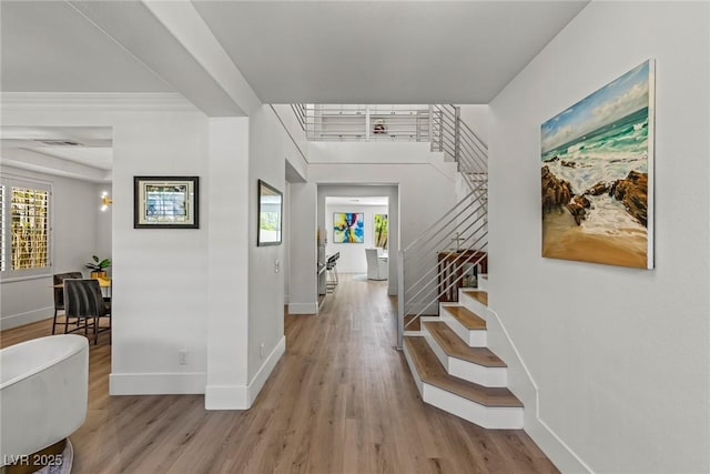 712 Proud Eagle Ln, Las Vegas, NV 89144 - entryway with stairway, light wood-style flooring, and plenty of natural light
