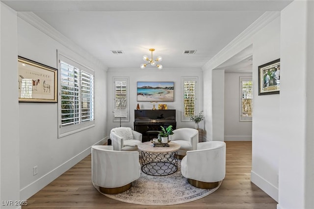 712 Proud Eagle Ln, Las Vegas, NV 89144 - sitting room featuring wood finished floors, crown molding, and a chandelier