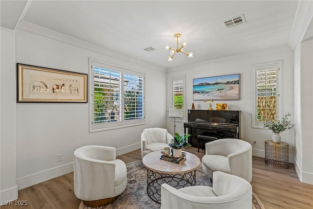 712 Proud Eagle Ln, Las Vegas, NV 89144 - sitting room with ornamental molding, wood finished floors, and a chandelier