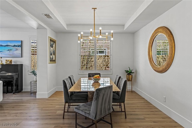 712 Proud Eagle Ln, Las Vegas, NV 89144 - dining space with a chandelier, a raised ceiling, and wood finished floors