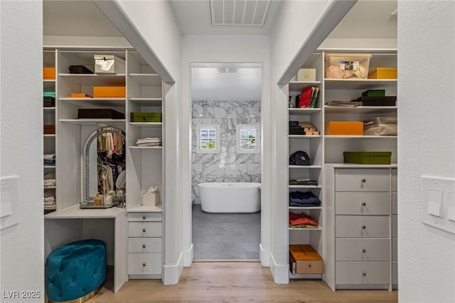 712 Proud Eagle Ln, Las Vegas, NV 89144 - walk in closet with wood finished floors