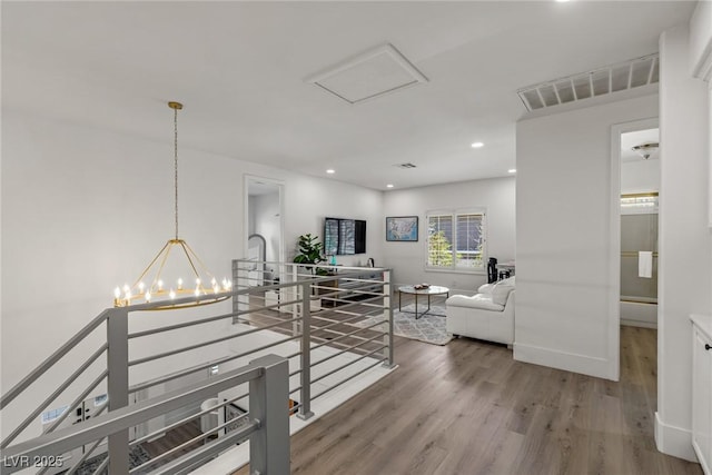 712 Proud Eagle Ln, Las Vegas, NV 89144 - corridor featuring an upstairs landing, wood finished floors, a chandelier, and recessed lighting