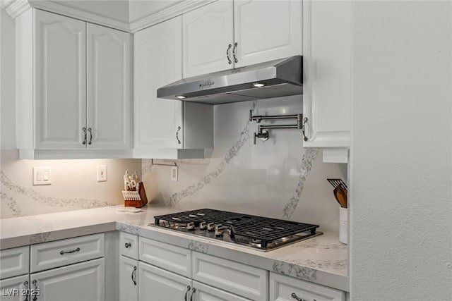 712 Proud Eagle Ln, Las Vegas, NV 89144 - kitchen with stainless steel gas cooktop, under cabinet range hood, and white cabinetry