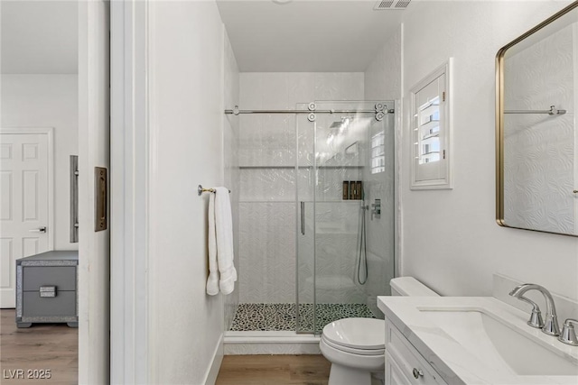 712 Proud Eagle Ln, Las Vegas, NV 89144 - bathroom with wood finished floors, a shower stall, and vanity