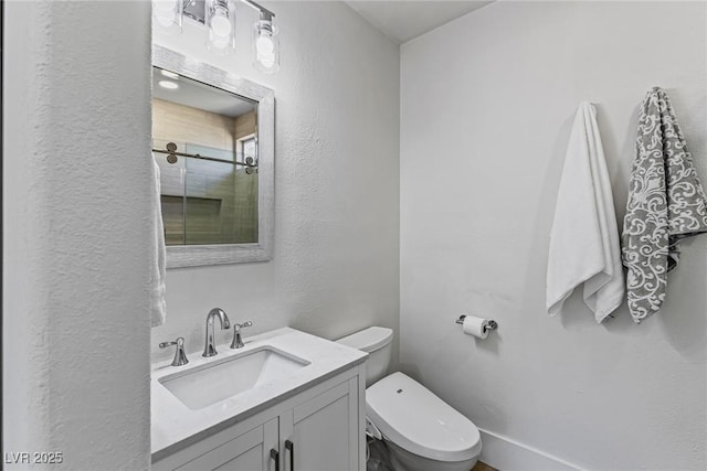 712 Proud Eagle Ln, Las Vegas, NV 89144 - bathroom featuring vanity, a shower, and a textured wall