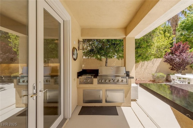 712 Proud Eagle Ln, Las Vegas, NV 89144 - view of patio / terrace with an outdoor kitchen