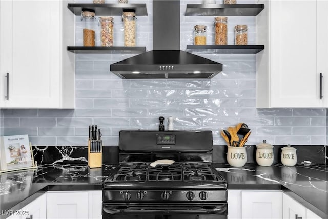 6536 Pleasant Plains Way, Las Vegas, NV 89108 - kitchen featuring wall chimney exhaust hood, black range with gas cooktop, white cabinets, and decorative backsplash