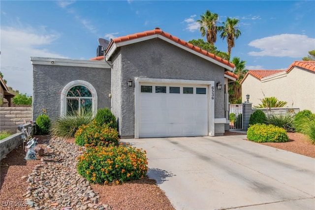 6536 Pleasant Plains Way, Las Vegas, NV 89108 - view of front of house with an attached garage, driveway, stucco siding, a gate, and a tiled roof