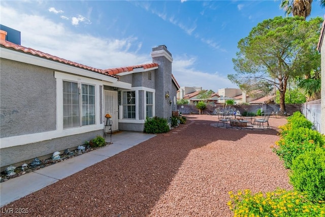 6536 Pleasant Plains Way, Las Vegas, NV 89108 - fenced backyard featuring a patio and an outdoor fire pit