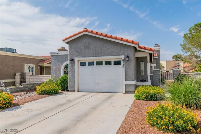 6536 Pleasant Plains Way, Las Vegas, NV 89108 - view of front of house with driveway, an attached garage, stucco siding, and a tiled roof