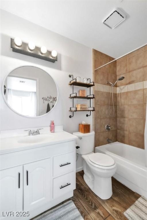 6536 Pleasant Plains Way, Las Vegas, NV 89108 - bathroom featuring vanity, wood finished floors, and shower / washtub combination