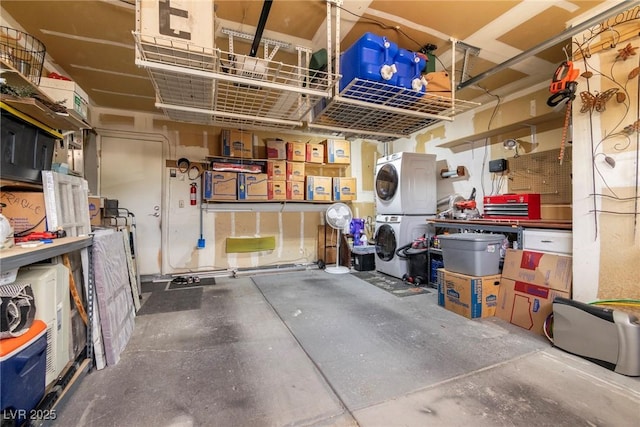 6536 Pleasant Plains Way, Las Vegas, NV 89108 - garage with stacked washer and clothes dryer and a workshop area