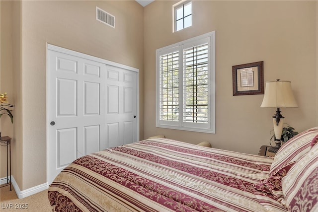 4408 Oasis Plains Ave, North Las Vegas, NV 89085 - bedroom featuring a closet, carpet floors, and a towering ceiling