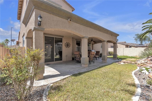 4408 Oasis Plains Ave, North Las Vegas, NV 89085 - rear view of property featuring stucco siding and a patio area