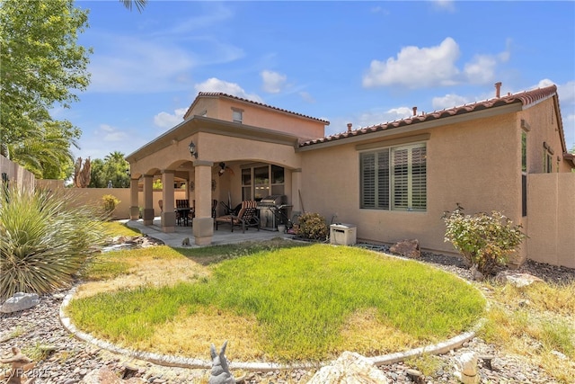 4408 Oasis Plains Ave, North Las Vegas, NV 89085 - back of property with stucco siding, a patio, and a tile roof
