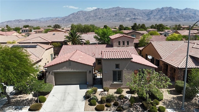 4408 Oasis Plains Ave, North Las Vegas, NV 89085 - view of front of house with stucco siding, a tile roof, a garage, concrete driveway, and a residential view