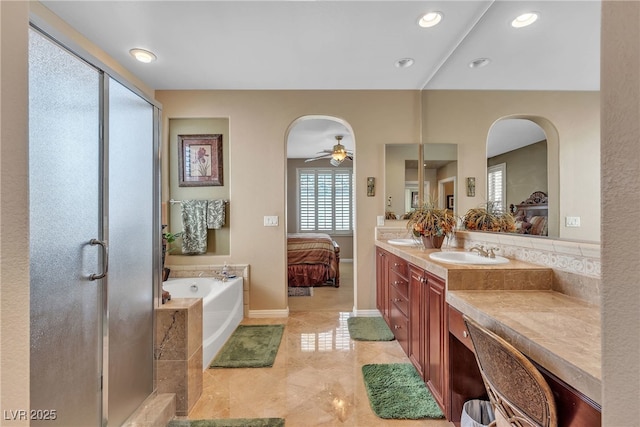 4408 Oasis Plains Ave, North Las Vegas, NV 89085 - ensuite bathroom featuring a bath, double vanity, a shower stall, ceiling fan, and recessed lighting