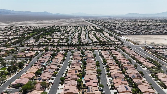 4408 Oasis Plains Ave, North Las Vegas, NV 89085 - aerial view of property and surrounding area featuring a mountain backdrop and nearby suburban area