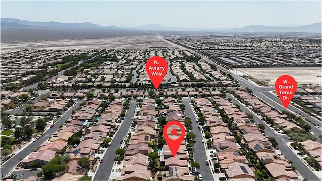 4408 Oasis Plains Ave, North Las Vegas, NV 89085 - aerial view of residential area featuring a mountain backdrop