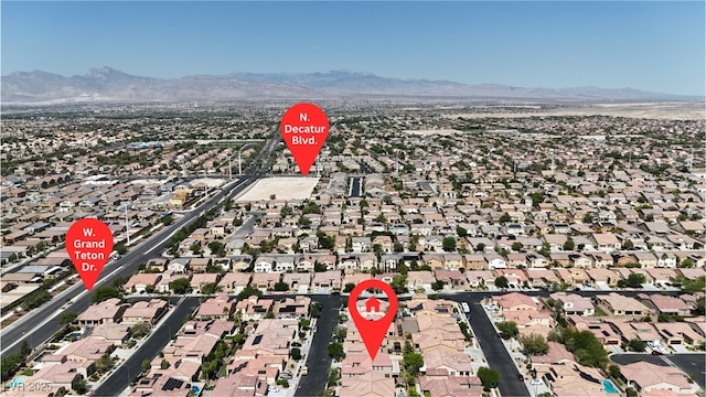 4408 Oasis Plains Ave, North Las Vegas, NV 89085 - aerial view of property and surrounding area with mountains and nearby suburban area