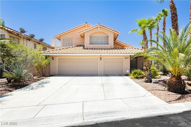 8875 Tidal Bay Dr, Las Vegas, NV 89117 - mediterranean / spanish-style house with driveway, stucco siding, and a tile roof