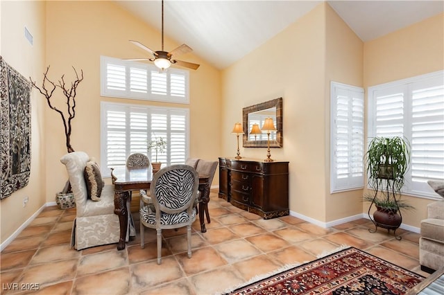 8875 Tidal Bay Dr, Las Vegas, NV 89117 - tiled dining space featuring healthy amount of natural light, a ceiling fan, and high vaulted ceiling