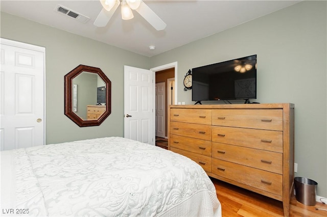 8875 Tidal Bay Dr, Las Vegas, NV 89117 - bedroom with light wood-type flooring and ceiling fan