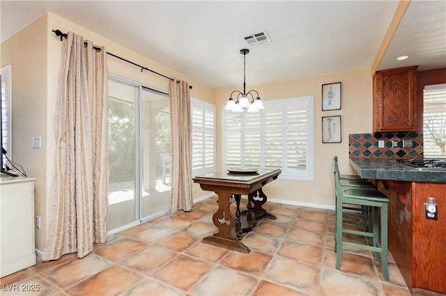 8875 Tidal Bay Dr, Las Vegas, NV 89117 - dining space featuring healthy amount of natural light and a chandelier