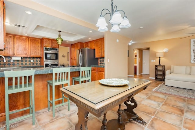 8875 Tidal Bay Dr, Las Vegas, NV 89117 - dining area featuring a raised ceiling, a chandelier, and recessed lighting