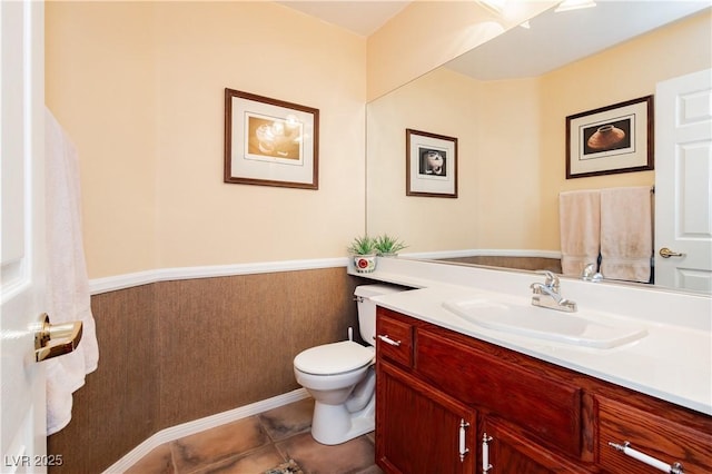 8875 Tidal Bay Dr, Las Vegas, NV 89117 - half bath featuring vanity, tile patterned floors, and a wainscoted wall