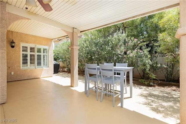 8875 Tidal Bay Dr, Las Vegas, NV 89117 - fenced backyard with ceiling fan, outdoor dining space, and a patio area
